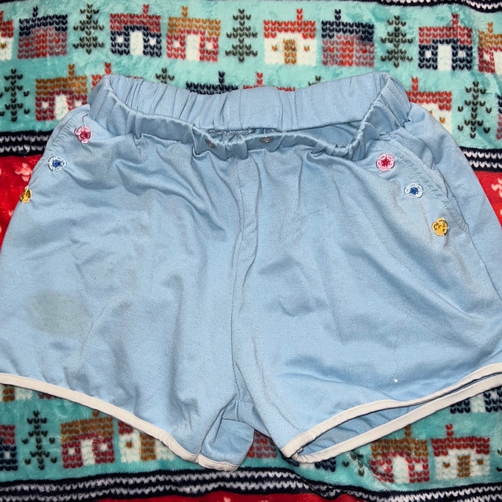 Light blue comfy shorts with flower design on pockets
